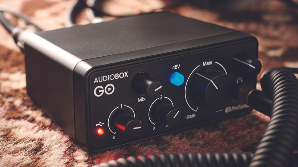 A PreSonus Audiobox Go audio interface on some carpet