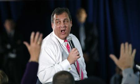 New Jersey Governor Chris Christie speaks to local residents of Belmar, New Jersey, and other shore towns in Monmouth County during a town hall meeting to discuss federal funds for recovery from hurricane Sandy, in Belmar, March 25, 2014. REUTERS/Mike Segar