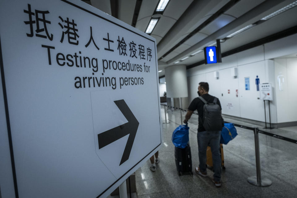 HONG KONG, CHINA - 2022/09/07: A sign guiding the arrivals in the Hong Kong International Airport to walk to the COVID testing area. As countries across the globe ease quarantine policies, the Hong Kong Government announced a decision to ease its COVID-19 quarantine policy. From 12 August 2022, hotel quarantine for overseas arrivals will be reduced from 7 to 3 days, followed by four days of medical surveillance at home or alternative accommodation, arrivals should be tested with PCR and RAT test as soon as they cross the border. (Photo by Alex Chan Tsz Yuk/SOPA Images/LightRocket via Getty Images)