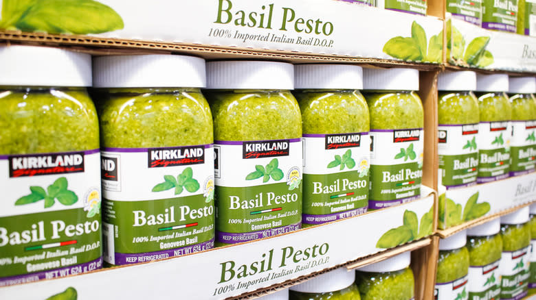 Rows of Kirkland Signature Basil Pesto in Costco aisle