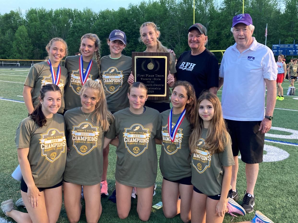 The Rumson-Fair Haven girls track team poses after winning the 2023 Monmouth County title