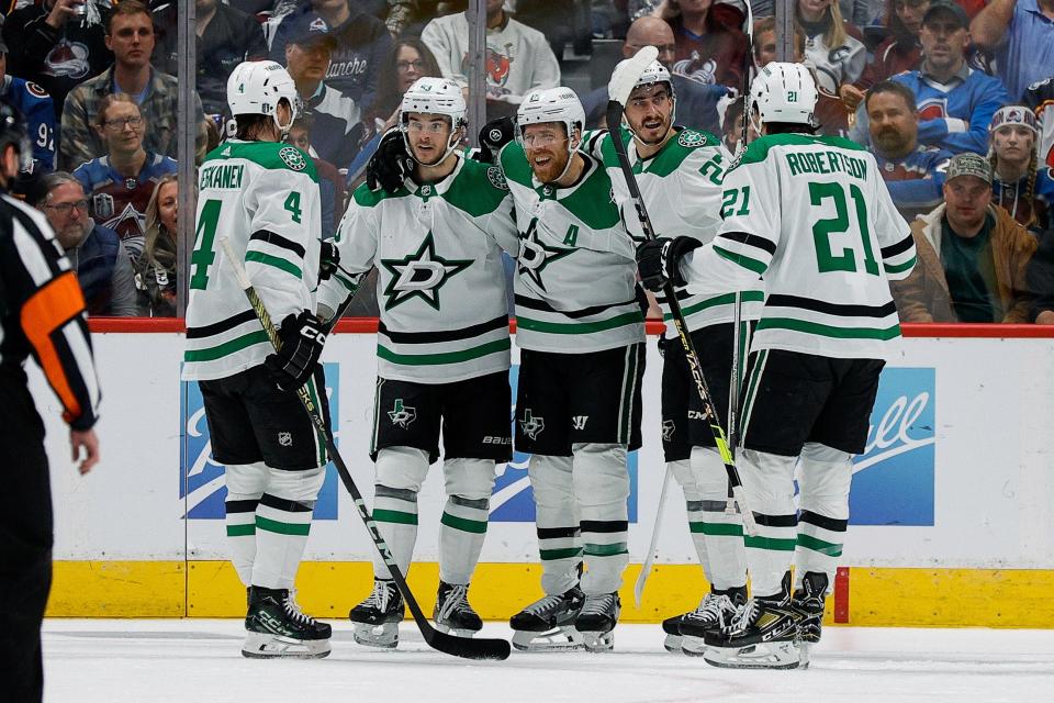 The Dallas Stars center Wyatt Johnston celebrates his goal with teammates during Game 4.