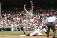 BOSTON, MA - JULY 7: First baseman Mark Teixeira #25 of the New York Yankees leaps to avoid sliding David Ortiz #34 of the Boston Red Sox after Ortiz was doubled off of first during the sIxth inning of game one of a doubleheader at Fenway Park on July 7, 2012 in Boston, Massachusetts. (Photo by Winslow Townson/Getty Images)