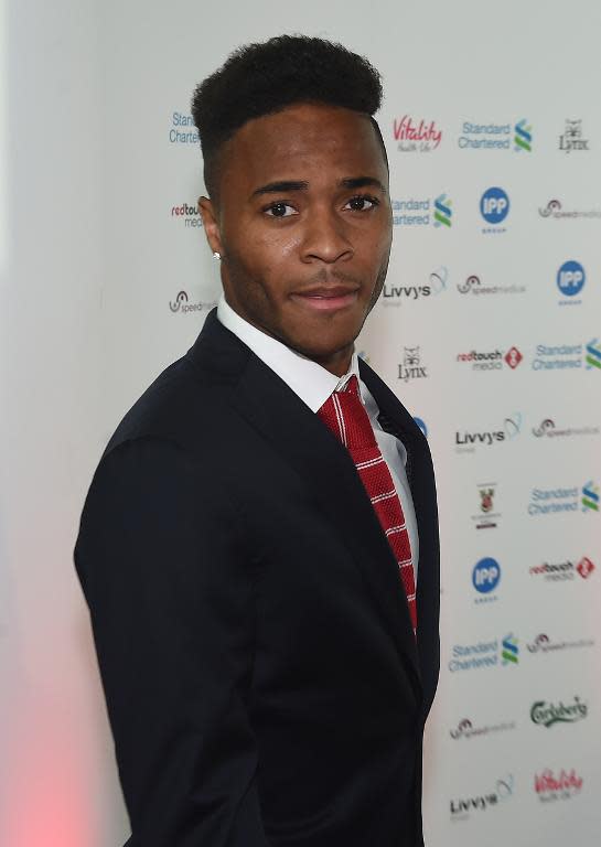 Liverpool's English midfielder Raheem Sterling (R) arrives to attend the Liverpool Football Club 2015 Players' Awards at the Echo Arena in Liverpool on May 19, 2015