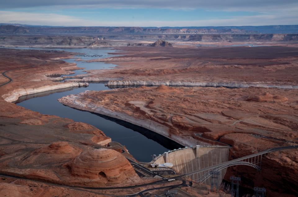 Glen Canyon Dam pictured on Feb. 3, 2022, in the Glen Canyon National Recreation Area. Essentially full at the turn of the 21st century, the reservoir behind the dam is now at one-quarter of capacity.