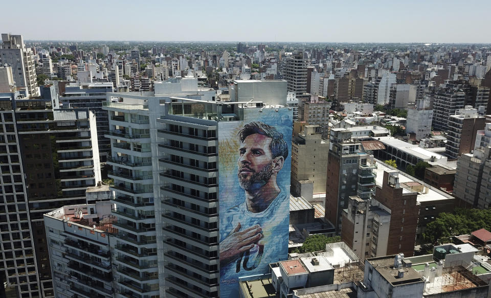 A mural of soccer player Lionel Messi covers a building in Rosario, Argentina, Wednesday, Dec. 14, 2022. (AP Photo/Rodrigo Abd)