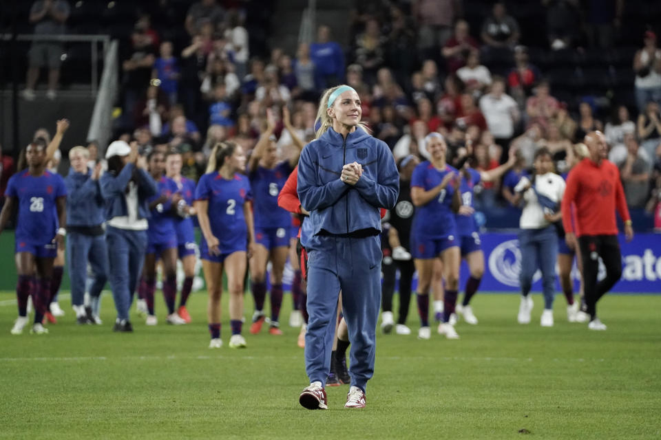 United States' Julie Ertz walks around the pitch as the crowd cheers after her final soccer match, Thursday, Sept. 21, 2023, in Cincinnati. The United States defeated South Africa in an international friendly, 3-0. (AP Photo/Joshua A. Bickel)