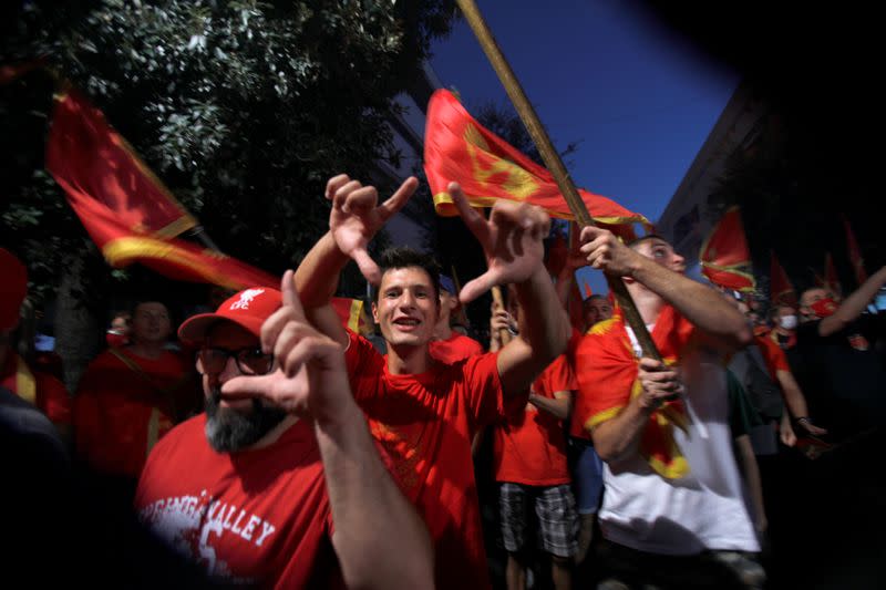 Man shout slogans during post-election patriotic rally in Podgorica