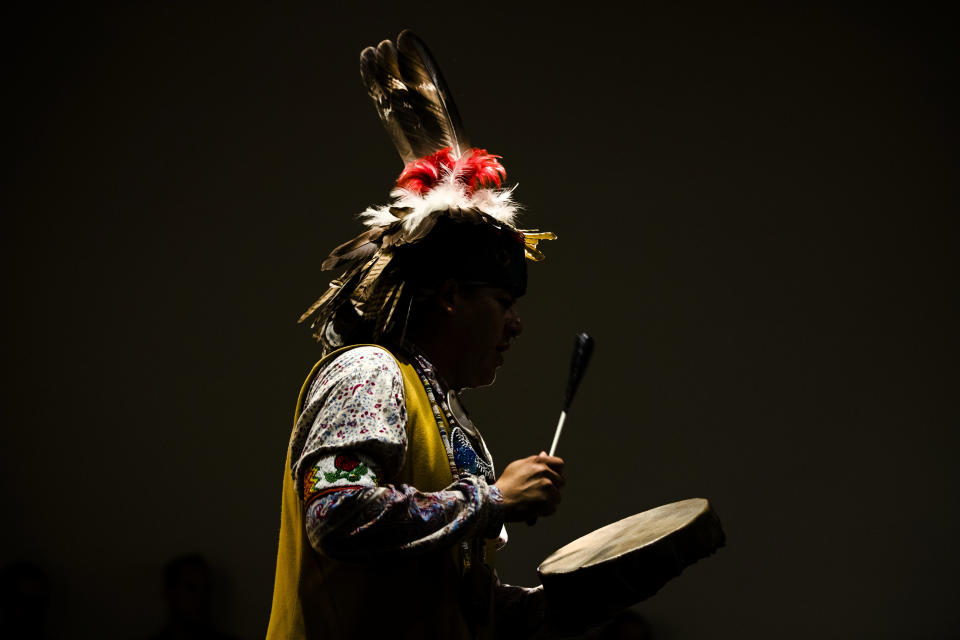 <p>Jordan Smith of the Mohawk Nation Bear Clan performs with the Longhouse Singers and Dancers representing the Oneida Nation at the Museum of the American Revolution in Philadelphia, Pa., Monday, Oct. 9, 2017. (Photo: Matt Rourke/AP) </p>