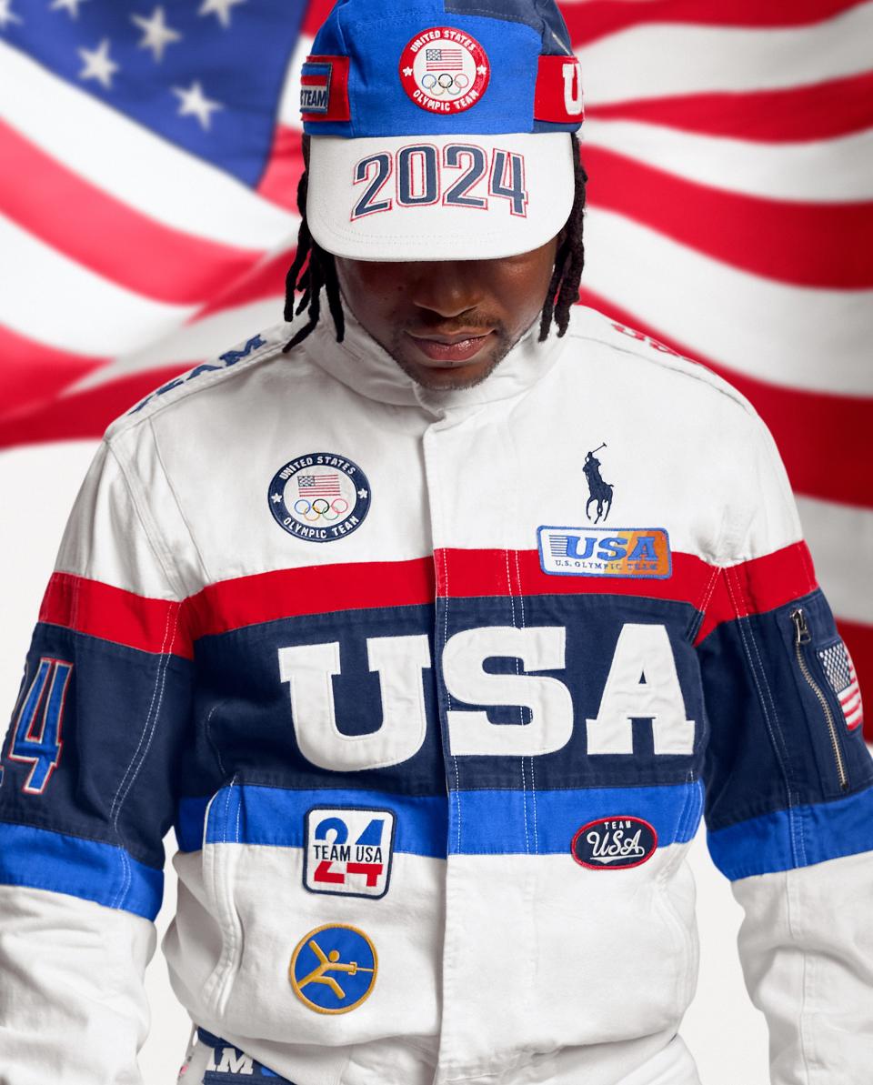 Olympic fencer Daryl Homer wears the closing ceremony uniform.