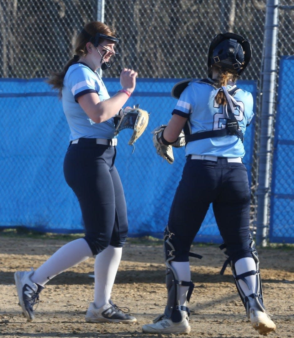 York's McKayla Kortes, left, and catcher Lindsay Rivers walk off the field after an inning in Monday's season-opening 10-0 win over Wells. Kortes threw her fifth career no-hitter for the defending Class B state champions.