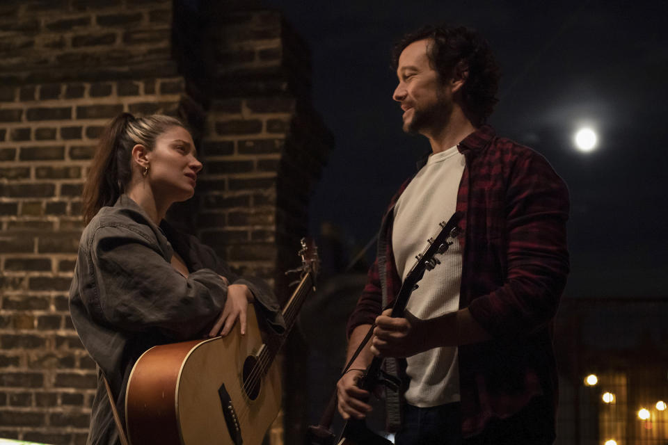 This image released by Apple TV+ shows Eve Hewson, left, and Joseph Gordon-Levitt in a scene from "Flora and Son." (Apple TV+ via AP)