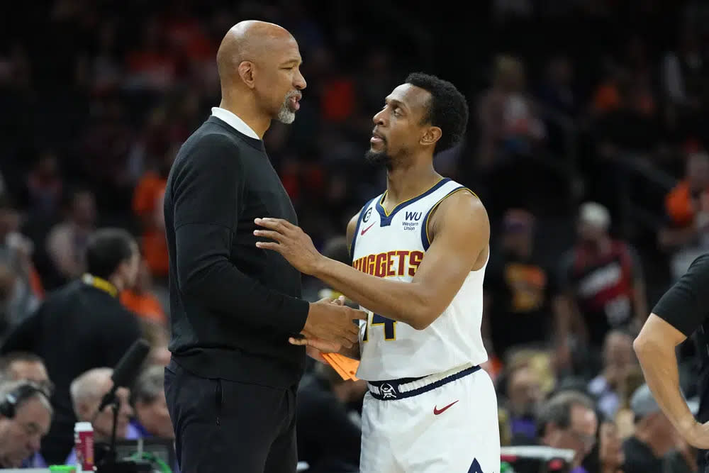 Denver Nuggets guard Ish Smith embraces Phoenix Suns head coach Monty Williams during the final seconds of Game 6 of an NBA basketball Western Conference semifinal game, Thursday, May 11, 2023, in Phoenix. (AP Photo/Matt York)