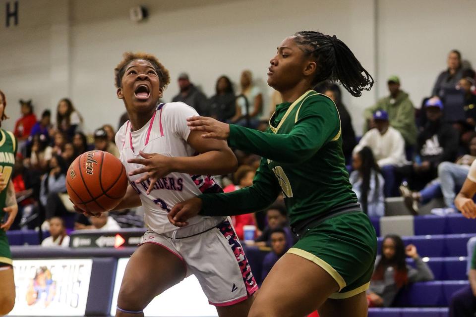 Huntington's Kyndal Graham goes up for a bucket against Acadiana Monday night in the LHSAA Select Division I playoff contest.