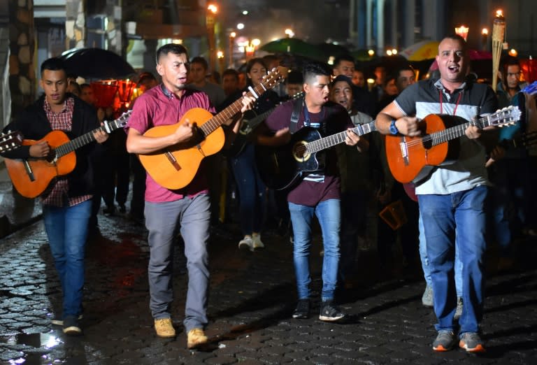 Catholic faithfuls take part in the 'pilgrimage of light,' in Ciudad Barrios, blessed Monsignor Oscar Romero's home town, on October 13, 2018, on the eve of his canonization