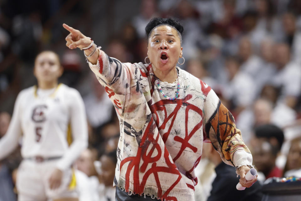 South Carolina head coach Dawn Staley directs her team against UConn during the first half of an NCAA college basketball game in Columbia, S.C., Sunday, Feb. 11, 2024. (AP Photo/Nell Redmond)