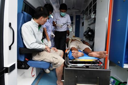 Rescued tourists are attended by medical personnel after a boat they were travelling in capsized off the tourist island of Phuket, Thailand, July 6, 2018. REUTERS/Sooppharoek Teepapan