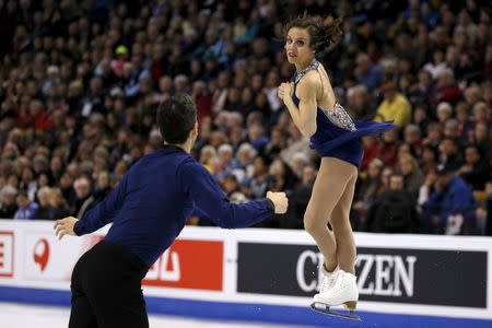 Meagan Duhamel and Eric Radford of Canada compete. REUTERS/Brian Snyder