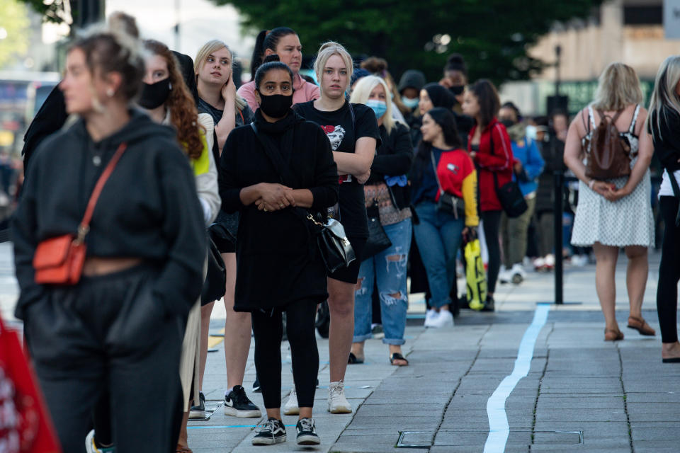 Shoppers queue at Primark in Birmingham as non-essential shops in England open their doors to customers for the first time since coronavirus lockdown restrictions were imposed in March.