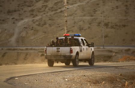 Kurdish peshmerga troops ride on a vehicle at Mount Sinjar, August 13, 2014. REUTERS/Rodi Said