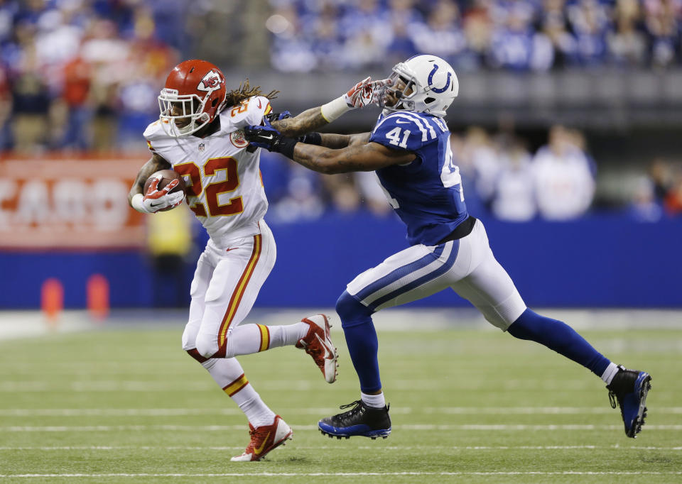 Kansas City Chiefs wide receiver Dexter McCluster (22) runs against Indianapolis Colts strong safety Antoine Bethea (41) during the second half of an NFL wild-card playoff football game Saturday, Jan. 4, 2014, in Indianapolis. Indianapolis defeated Kansas City 45-44. (AP Photo/Michael Conroy)