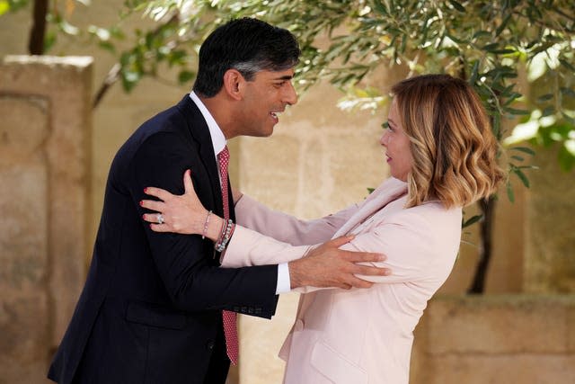 Rishi Sunak and Italian Prime Minister Giorgia Meloni embrace at the G7 summit 