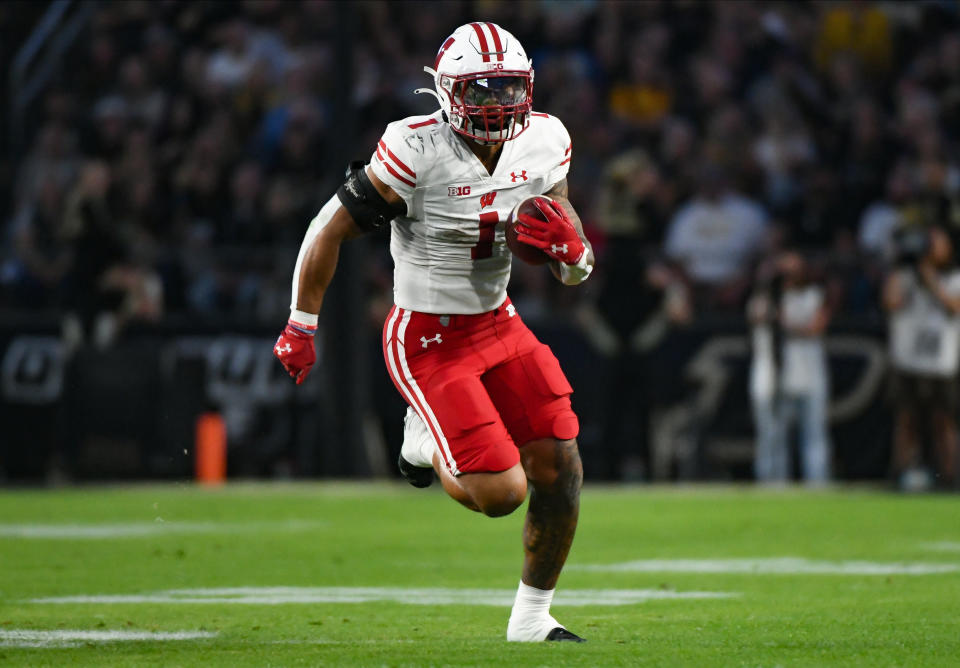 Sept. 22, 2023; West Lafayette, Indiana; Wisconsin Badgers running back Chez Mellusi (1) runs the ball during the first half at Ross-Ade Stadium. Robert Goddin-USA TODAY Sports