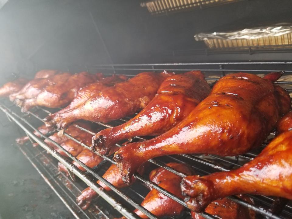 Chicken legs slow cook in a smoker at Big Bob's BBQ Pit set up outside Blooming Glen Pork & Catering in Hilltown on Saturdays in April through October.