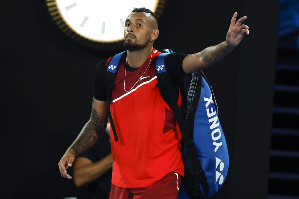 Nick Kyrgios of Australia gestures as he walks from Rod Laver Arena following his second round loss to Daniil Medvedev of Russia at the Australian Open tennis championships in Melbourne, Australia, Thursday, Jan. 20, 2022. (AP Photo/Hamish Blair)