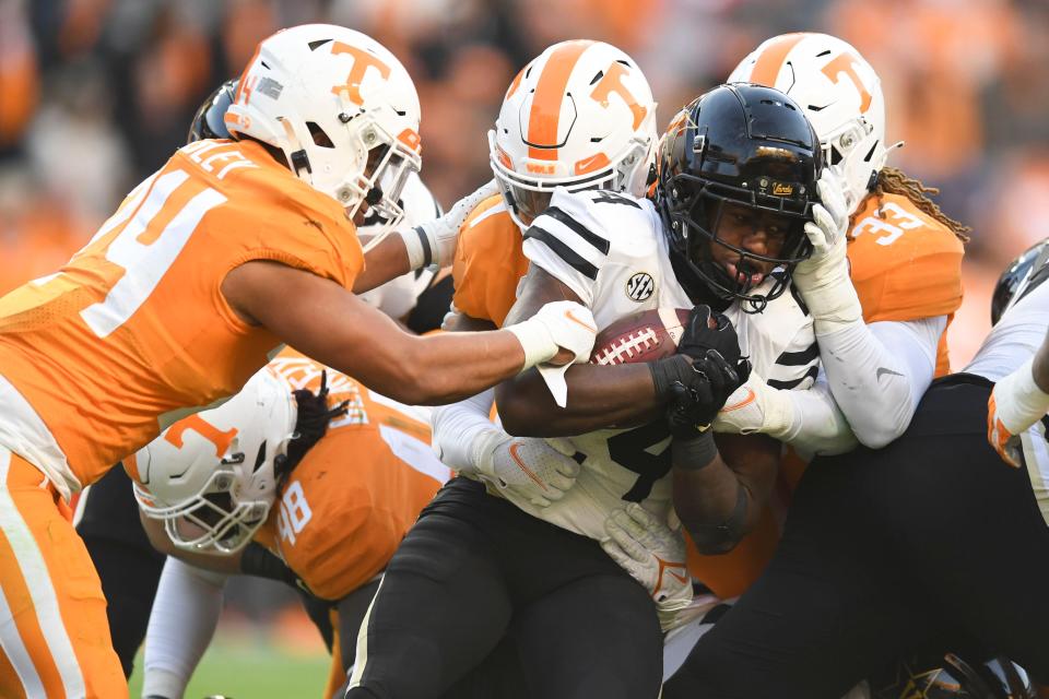 Vanderbilt running back Rocko Griffin (24) comes up against the Tennessee defense in the NCAA college football game between the Tennesse Volunteers and Vanderbilt Commodores in Knoxville, Tenn. on Saturday, November 27, 2021.