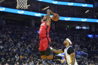 Houston Rockets guard Kevin Porter Jr. (3) dunks over Golden State Warriors guard Gary Payton II during the first half of an NBA basketball game in San Francisco, Friday, Jan. 21, 2022. (AP Photo/Jeff Chiu)