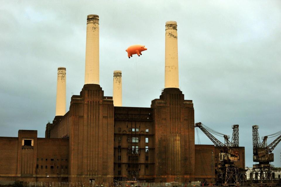 Battersea: A giant inflatable pig flies above Battersea Power Station on the banks of the river Thames in central London, during a recreation of the cover of the Pink Floyd album 'Animals' (PA)