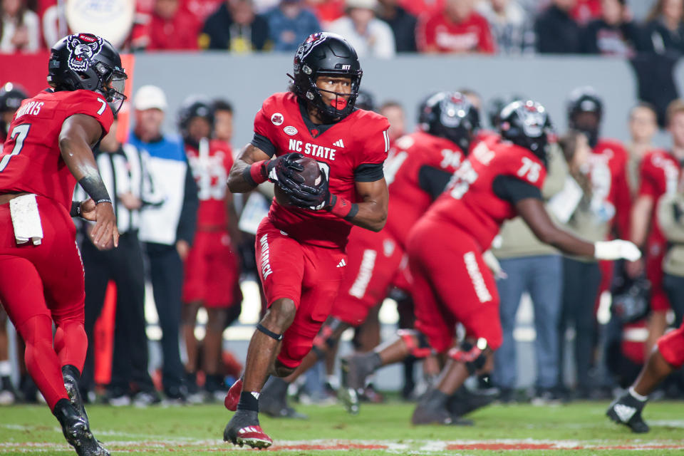 RALEIGH, NC - NOVEMBER 04: North Carolina State Wolfpack wide receiver Kevin Concepcion (10) gets the quick pitch in the college football game between the North Carolina State Wolfpack and the Miami Hurricanes on November 4, 2023 at Carter-Finley Stadium in Raleigh, NC. (Photo by Nicholas Faulkner/Icon Sportswire via Getty Images)