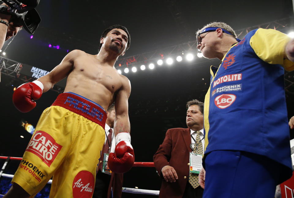 Manny Pacquiao, from the Philippines, gets ready before the welterweight title fight against  Floyd Mayweather Jr., on Saturday, May 2, 2015 in Las Vegas. (AP Photo/John Locher)