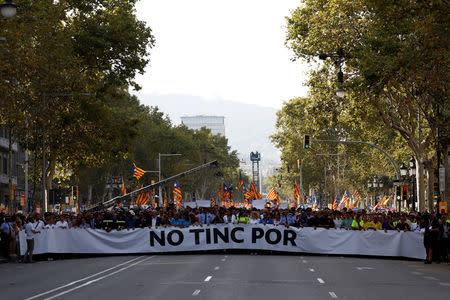 Representatives of rescue workers, police, health workers and citizens hold banner reading "We are not afraid" during a march of unity after last week attacks, in Barcelona, Spain, August 26, 2017. REUTERS/Juan Medina