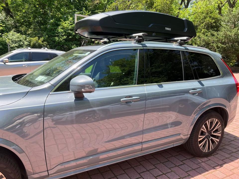 a rooftop cargo carrier mounted on a gh staffer's car