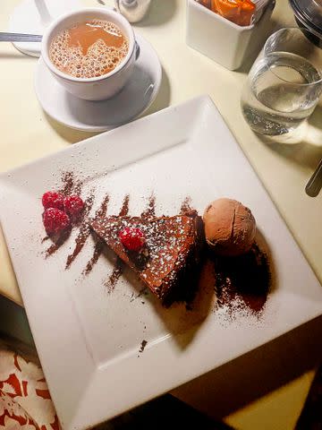 <p>Marissa Charles</p> The flourless chocolate cake is one of the dessert options, which can be paired with a scoop of gelati.