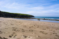 This intimate, sandy cove is sheltered from south-western winds from the surrounding cliffs, making it a perfect spot for sunbathing. When the tides are low, you can walk straight across to the nearby Whitesands Bay in St Davids. [Photo: Getty]