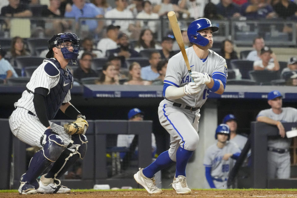 Kansas City Royals' Michael Massey, right, follows through after hitting a solo home run in the eighth inning of a baseball game against the New York Yankees, Friday, July 21, 2023, in New York. (AP Photo/Mary Altaffer)