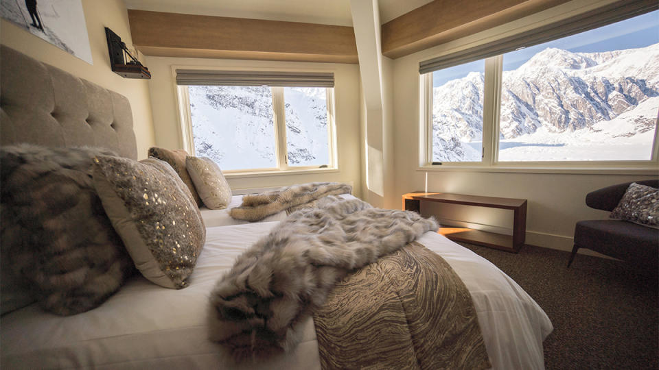 A bedroom at Sheldon Chalet offers views of the day’s seemingly limitless ski runs