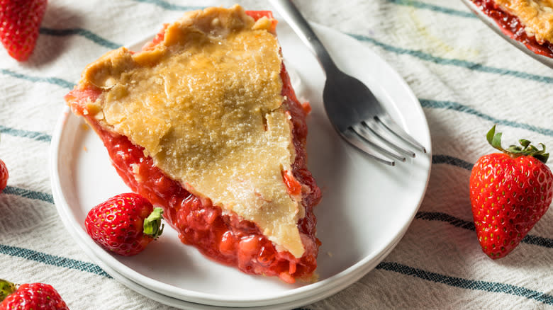 A plated slice of strawberry rhubarb pie