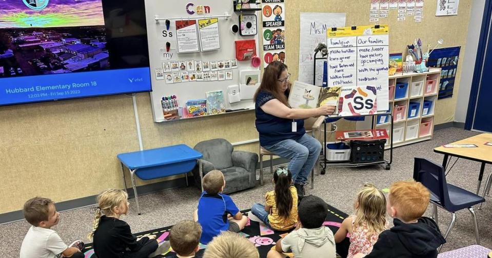 Kuna School Board vice chair Joy Thomas reads Skippyjon Jones, a children’s picture book, to a kindergarten class at Hubbard Elementary School on Sept. 15.