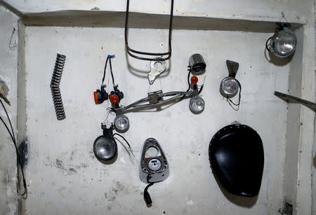 A view of spare parts hanging on the wall of a motorbike repair shop in Baghdad, Iraq December 31, 2018. REUTERS/Thaier Al-Sudani