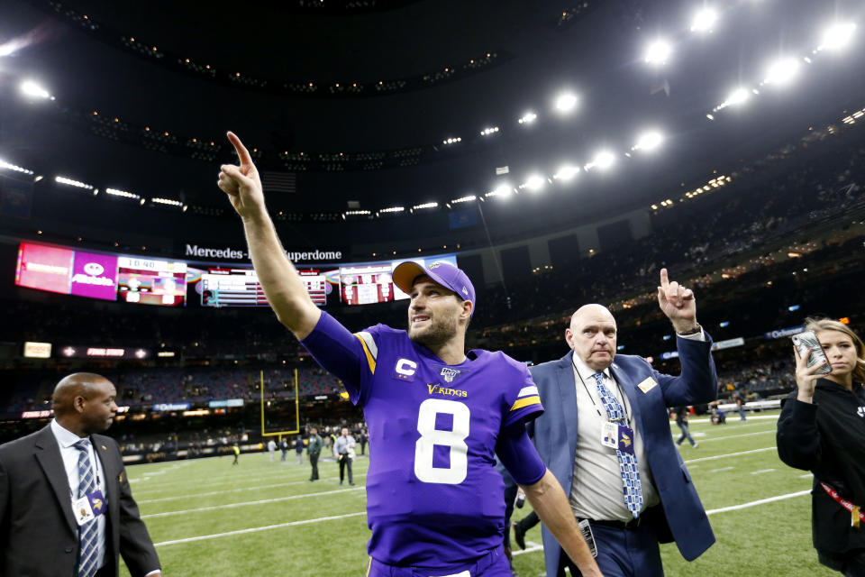 Minnesota Vikings quarterback Kirk Cousins (8) reacts as he walks off the field after their overtime win over the New Orleans Saints in an NFL wild-card playoff football game, Sunday, Jan. 5, 2020, in New Orleans. The Vikings won 26-20. (AP Photo/Butch Dill)