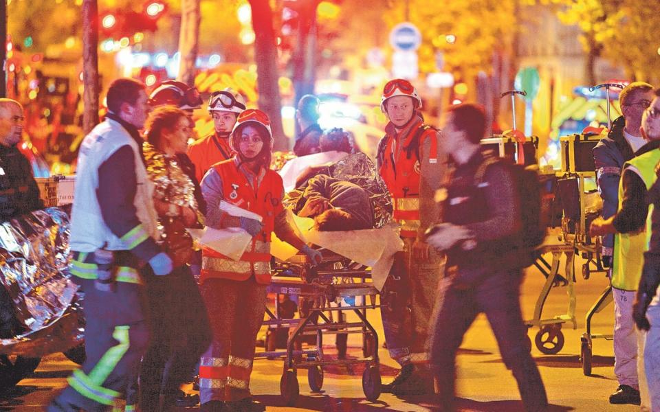 Paramedics take care of the wounded at the Bataclan - Getty Images