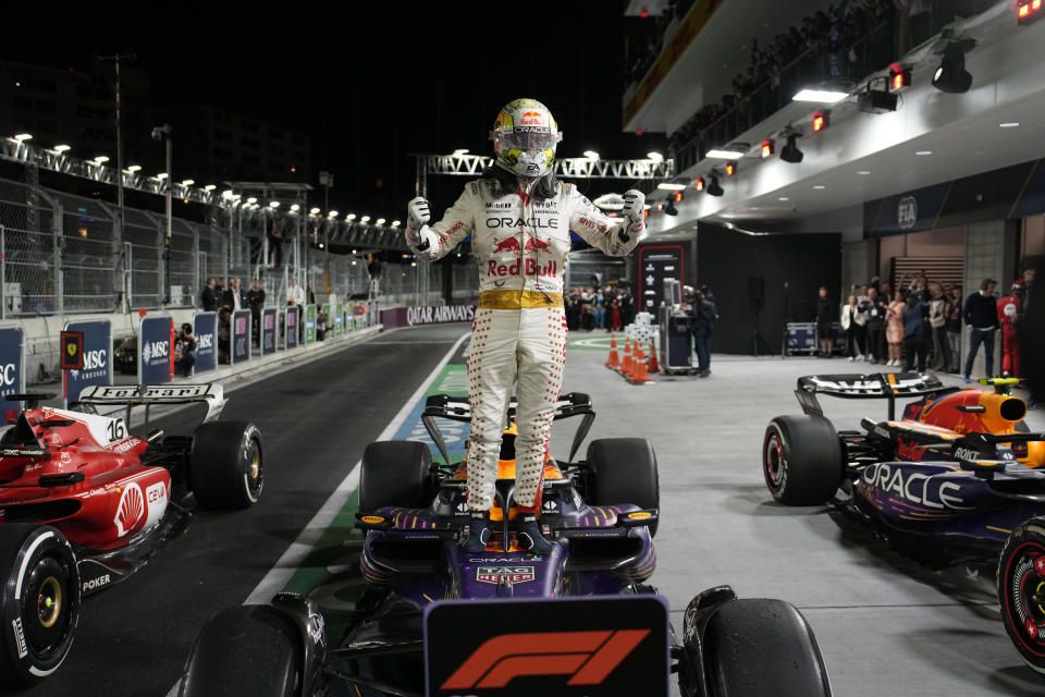 Red Bull driver Max Verstappen, of the Netherlands, stands on top of his car after winning the Formula One Las Vegas Grand Prix auto race, Saturday, Nov. 18, 2023, in Las Vegas. (AP Photo/John Locher)