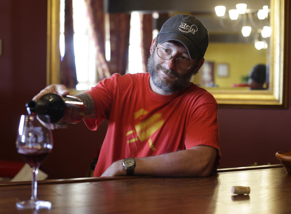 In this photo taken Friday, June 7, 2013, winemaker Josh Stein of Stein Family Wines pours a glass of his Same Sex Meritage red wine at his tasting room on Treasure Island in San Francisco. Gay marriage has been a hot topic for some months now, so perhaps it's not surprising the wine world has taken note with two new wines that declare their support for same-sex couples right on the label. (AP Photo/Eric Risberg)