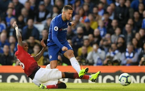 Eden Hazard of Chelsea is challenged by Ashley Young of Manchester United during the Premier League match between Chelsea FC and Manchester United at Stamford Bridge - Credit: Darren Walsh/Chelsea FC via Getty Images