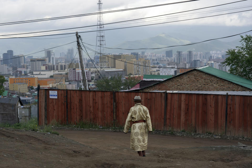 Byambasambuu Gombosuren leaves after casting his vote at a polling station in the Ger District on the outskirts of Ulaanbaatar, Mongolia, Friday, June 28, 2024. (AP Photo/Ng Han Guan)