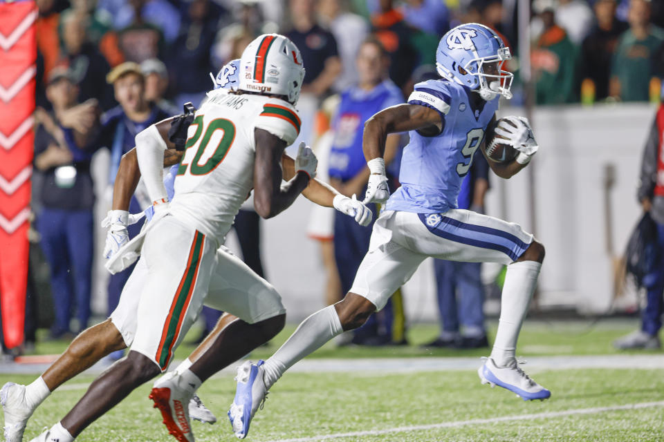 Oct 14, 2023; Chapel Hill, North Carolina, USA; North Carolina Tar Heels wide receiver Devontez Walker (9) runs for a touchdown after a catch against the Miami Hurricanes in the second half at Kenan Memorial Stadium. Mandatory Credit: Nell Redmond-USA TODAY Sports